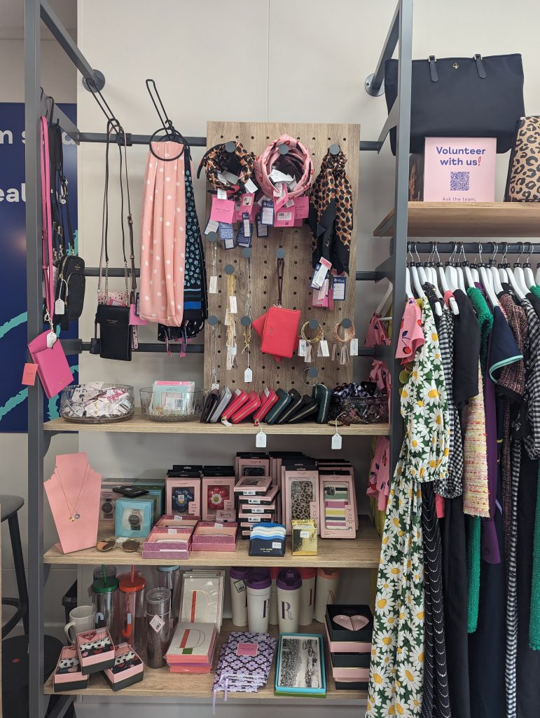 Mind Charity shop display with kate spade products including dresses, Jewellery and accessories